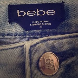 Low-waisted lightwashed distressed bebe jeans